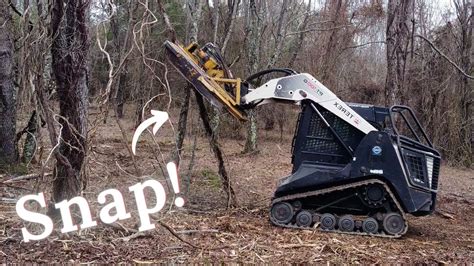 take down trees with skid steer|skid steer for fence removal.